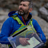 Using a waterproof clipboard in a rocky environment