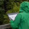 Ecologists love waterproof clipboards, this one is being used in the rainy english countryside.