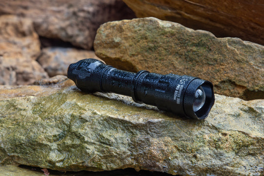 Nightfox XB5 Pro INFRARED LED TORCH - 940nm | Placed on a rock | Wet